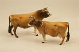 Beswick Jersey bull and cow (1422/1345), Champion Dunsley Coyboy and Champion Newton Tinkle,