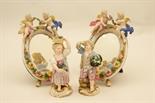 Pair of Meissen figures of grape pickers, late 19th Century, decorated in colours heightened with