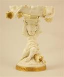 Moore Brothers figural bonbon dish, circa 1880-91, the frilled bowl supported on a cherub seated