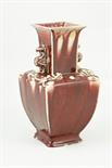 Chinese sang de boeuf vase, of archaic form, having a square neck with dragon form lug handles,