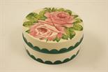 Wemyss pottery circular box and cover, decorated with pink roses and green foliage, impressed and
