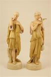 Pair of Royal Dux figures, circa 1920, modelled as Grecian beauties and decorated in green, gilt,