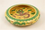 Chinese aubergine and green dragon bowl, shallow form with inverted rim, incised with dragons
