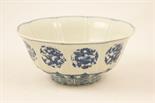 Chinese blue and white deep bowl, the sides fluted and decorated with scrolling dragon medallions