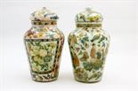 Two decalcomania lidded glass jars, shouldered form with domed covers, worked in Cantonese taste,