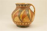 Charlotte Rhead Florentine jug, circa 1930s, globular form with a wide neck, tubelined decoration in