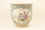Chinese famille rose jardiniere, decorated with panels of elegant ladies within a walled garden in