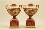 Pair of Vienna ornamental pedestal urns, each hand decorated with a classical scene of Diana and