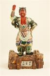 Japanese Kutani porcelain figure of a warrior, Taisho (1912-26), decorated throughout in colours,