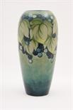 Moorcroft Leaves and Berries vase, circa 1918-29, slender ovoid shape decorated with grey green