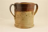 Massive salt glazed stoneware loving cup, early 19th Century, cylinder body in two tone brown,