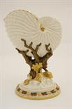 Royal Worcester nautilus shell vase, circa 1888, decorated in an ivory glaze with bronze glazed