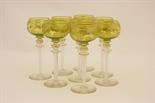 Set of eight gilt decorated hock glasses, 20th Century, with gilt decorated lime green tinted