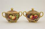 Pair of fruit decorated sucriers by A R Budd, one decorated with apples and grapes, the other with