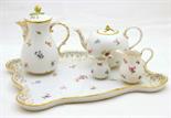 Meissen composite cabaret set, decorated with Deutsche Blumen comprising bullet shaped teapot and