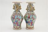 Pair of Cantonese famille rose vases, mid 19th Century, ovoid form with trumpet neck, with applied