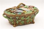 Minton majolica game pie dish and cover, circa 1866, the cover heavily moulded with dead game,