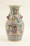 Cantonese famille rose vase, late 19th Century, ovoid form with trumpet neck, with applied Dogs of