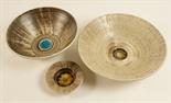 Two Purbeck Pottery bowls, decorated with a grey and brown striated glaze centred with a pool of