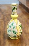 Della Robbia bottle vase by Enid Woodhouse, circa 1895, decorated with panels of stylised foliage in