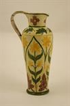 Della Robbia jug by Enid Woodhouse, circa 1895, shouldered form decorated with narcissi in yellow