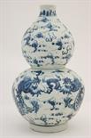 Chinese blue and white gourd vase, 19th Century, decorated with scrolling dragons chasing flaming