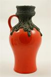 West German lava jug, 1970s, with a thick lava glaze to the neck against an orange speckled