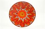 Poole Delphis plaque decorated with orange and white flowerhead design against a deep red ground,