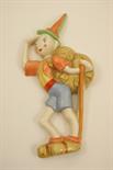 Crown Devon hiker wall plaque, decorated in coloured glazes, 26cm