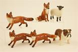 Six Beswick models including three small standing foxes, no. 1440, 6cm, seated fox, no. 1748, small