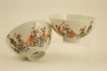 Pair of Chinese Republic bowls, decorated with boys playing instruments in grey and terracotta