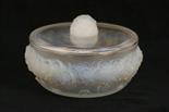 Lalique `Primeveres` circular box and cover, relief moulded with a band of flowerheads, tinted with