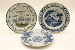 Three 18th Century delft plates, including garden fence pattern in blue, green and terracotta (