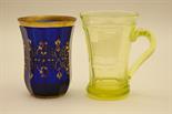 Bohemian gilded and faceted blue glass beaker, circa 1900, 11cm, also a German lime green tinted