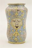 Italian maiolica albarello, traditional waisted form decorated with a mask in yellow and scrolling