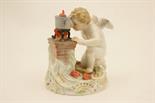 Meissen model of Cupid at a stove, late 19th/early 20th Century, decorated in naturalistic