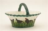 Wemyss black hens egg basket, fluted oval form with ropetwist handle, decorated with a band of black