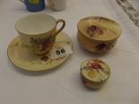 WORCESTER; peach ground cabinet cup and saucer and 2 lidded vanity boxes (one lid a/f)