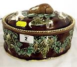 WEDGWOOD MAJOLICA; 19th Century brown glazed ground oval game casserole (cracked base)
