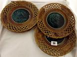 MAJOLICA; four Continental Majolica pierced border wall plates with central green glaze