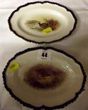 ROYAL WORCESTER; pair of wild fowl decorated small oval dishes, gilt royal blue fluted edge