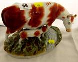 STAFFORDSHIRE POTTERY; 19th Century heifer and calf pottery group (minor damage)
