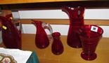 WHITEFRIARS; 3 red glass ewer jugs and 3 other pieces of red glass