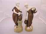 ROYAL DUX-STYLE; pair of bronzed effect Hohenstein figures of maidens drawing water, 14"