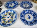 DELFT, polychrome stylized floral decorated circular charger & 3 other later Delft plates