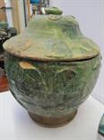 ANTIQUE SLIP GLAZE, green slip glaze circular lidded pedestal bowl, applied shell and medallion