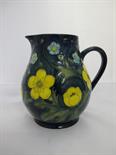 MOORCROFT, ``Buttercup`` design blue ground 5.5`` jug
