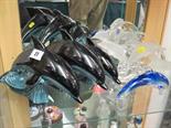 POOLE DOLPHINS, set of 3 graduated leaping dolphins, with a collection of 4 glass dolphin groups