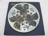 MOORCROFT, blue ground foliate and floral 8.5`` circular plate