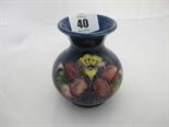 MOORCROFT, ``Hibiscus`` style pattern blue ground posy vase, late Queen Mary label